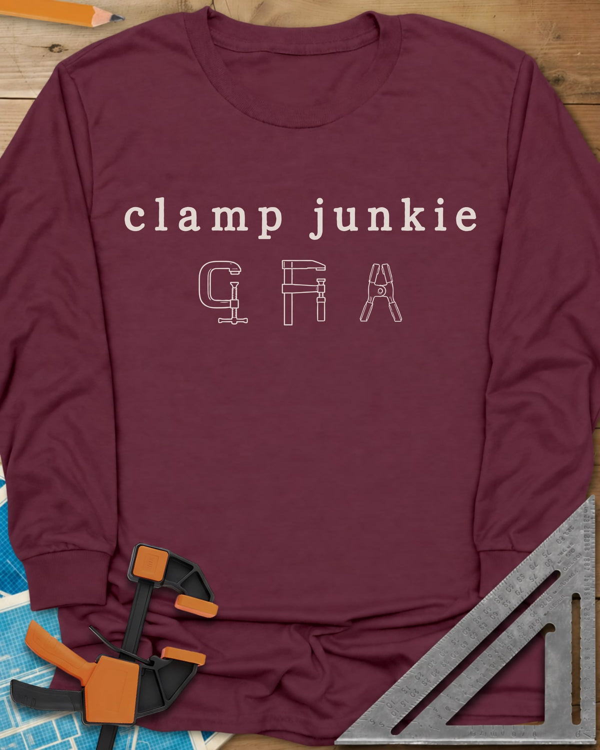 Clamp Junkie long sleeve shirt in Maroon, outline drawings of a C-clamp, a bar clamp and a spring clamp