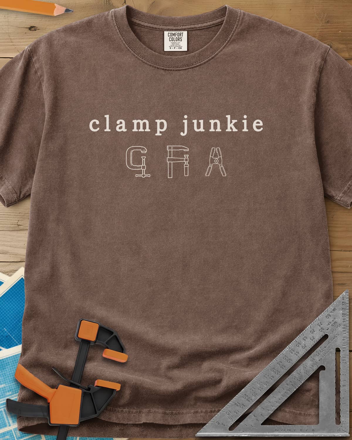 Clamp Junkie heavyweight tee in Espresso, outline drawings of a C-clamp, a bar clamp and a spring clamp