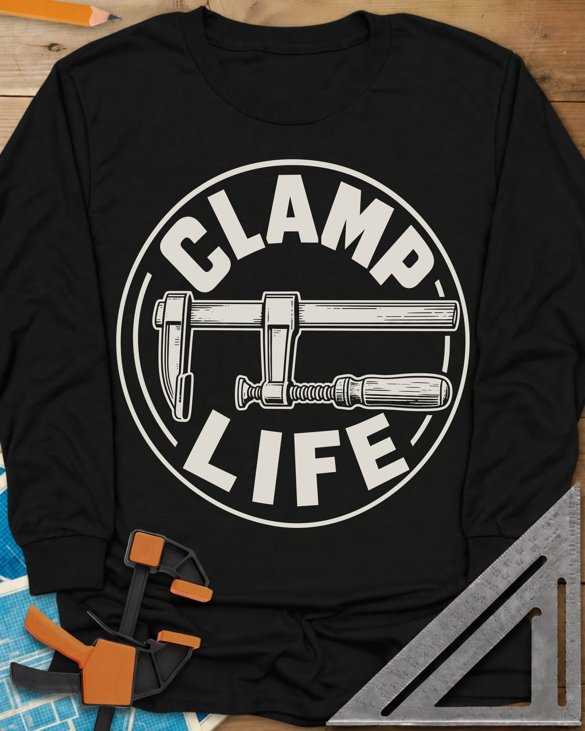 Clamp Life long sleeve shirt in Black, a wood-handled bar clamp inside a round badge