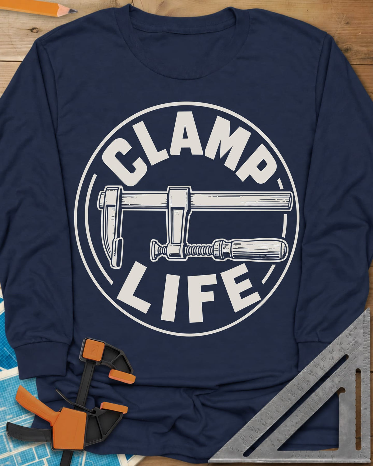 Clamp Life long sleeve shirt in Navy, a wood-handled bar clamp inside a round badge