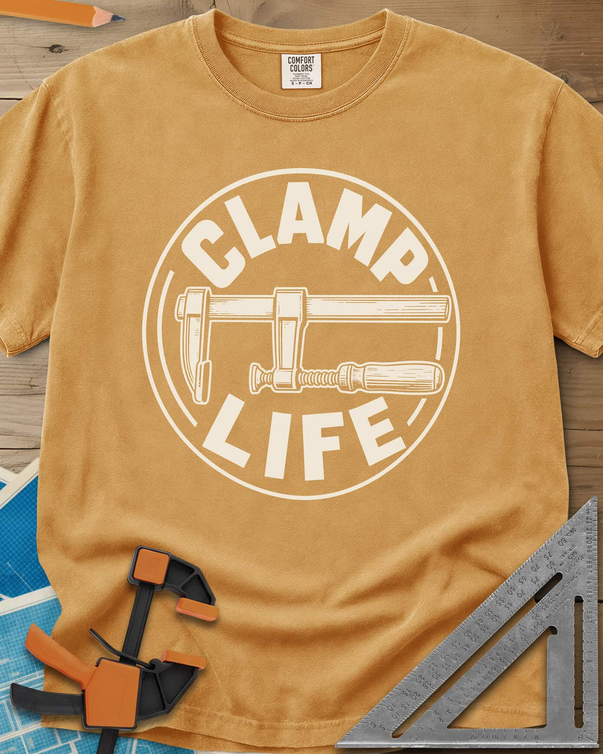 Clamp Life heavyweight tee in Mustard, a wood-handled bar clamp inside a round badge