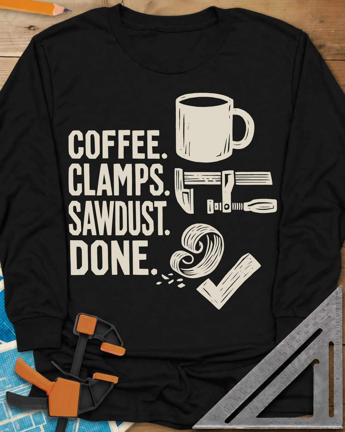Coffee Clamps long sleeve shirt in Black, a mug, a bar clamp, a wood shaving curl and a check mark