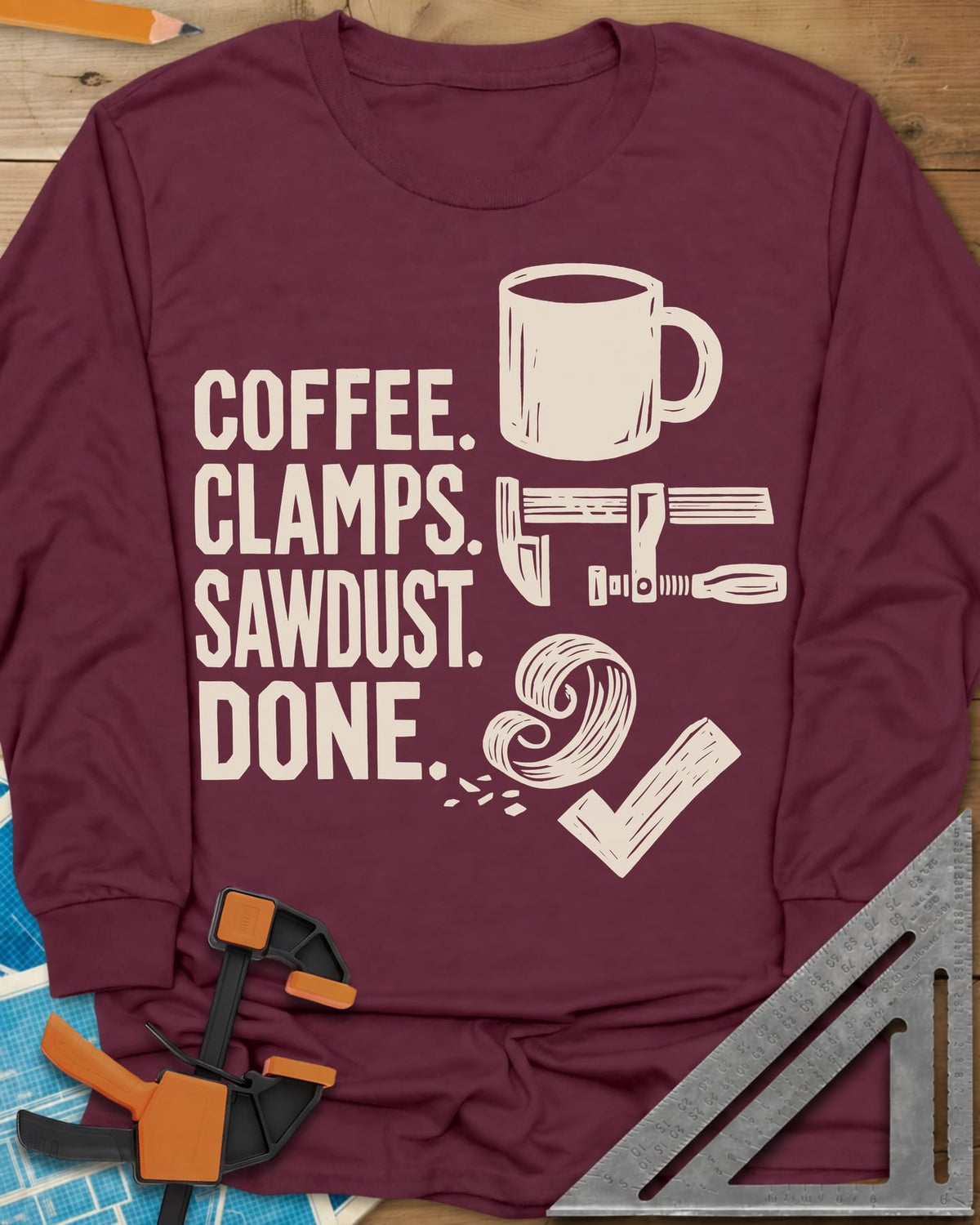 Coffee Clamps long sleeve shirt in Maroon, a mug, a bar clamp, a wood shaving curl and a check mark