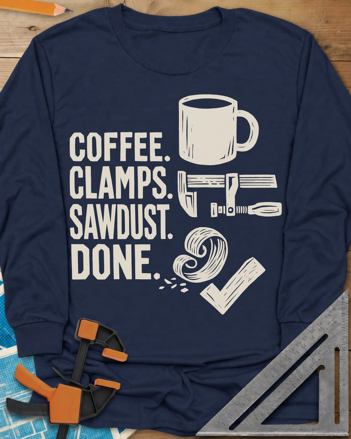 Coffee Clamps long sleeve shirt in Navy, a mug, a bar clamp, a wood shaving curl and a check mark