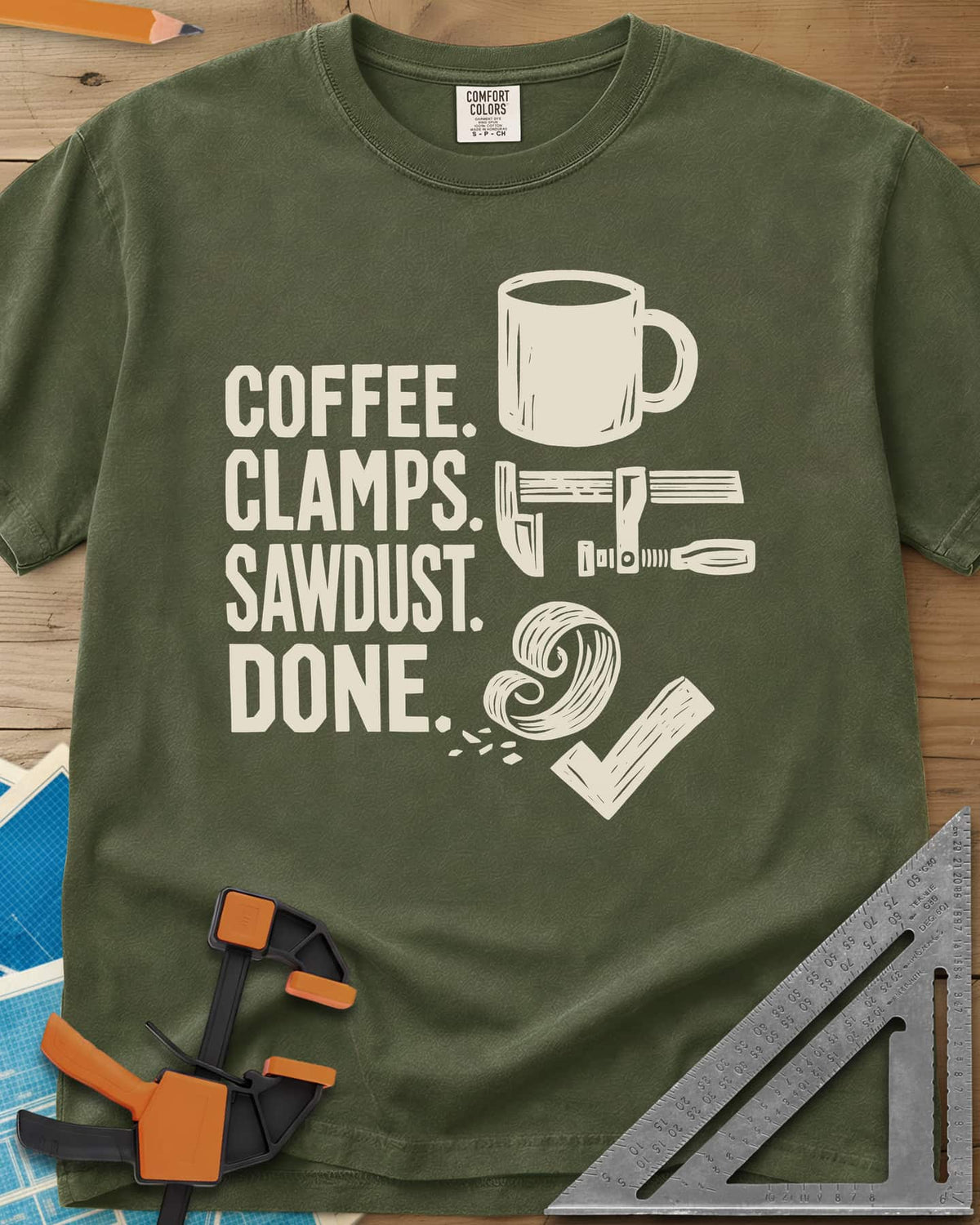 Coffee Clamps heavyweight tee in Hemp, a mug, a bar clamp, a wood shaving curl and a check mark