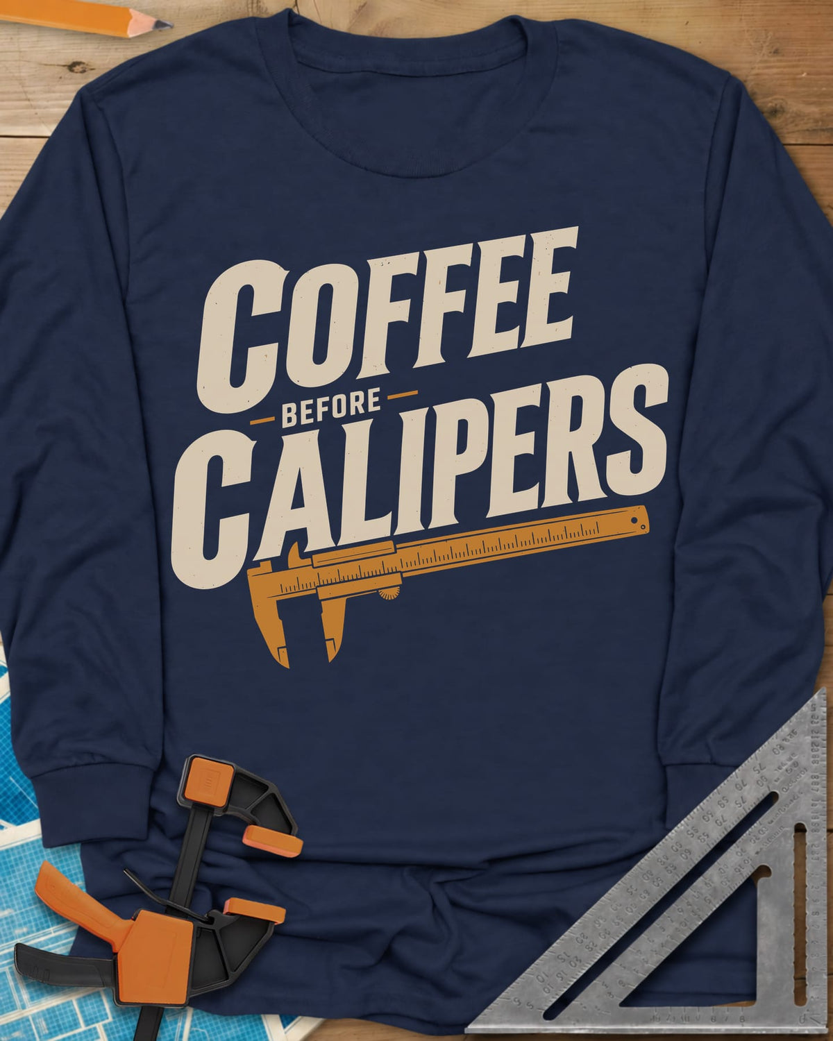 Coffee First long sleeve shirt in Navy, bold slanted lettering with an orange vernier caliper below