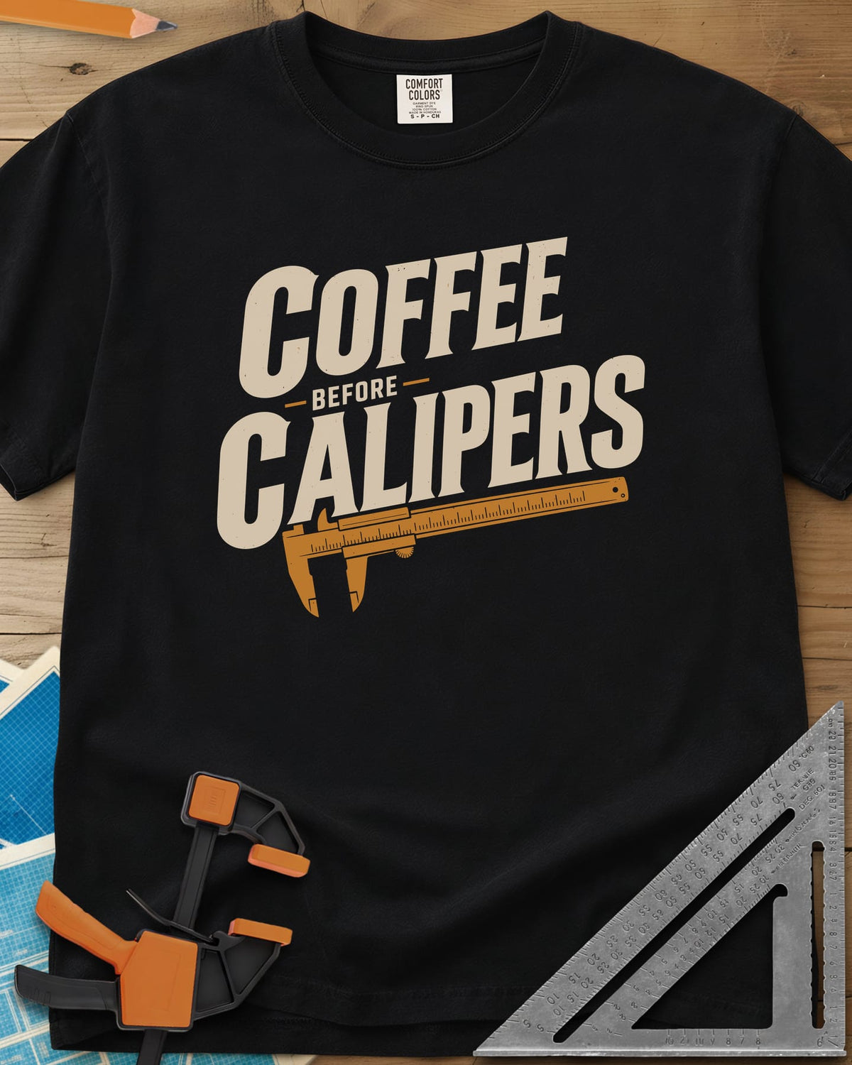 Coffee First heavyweight tee in Black, bold slanted lettering with an orange vernier caliper below