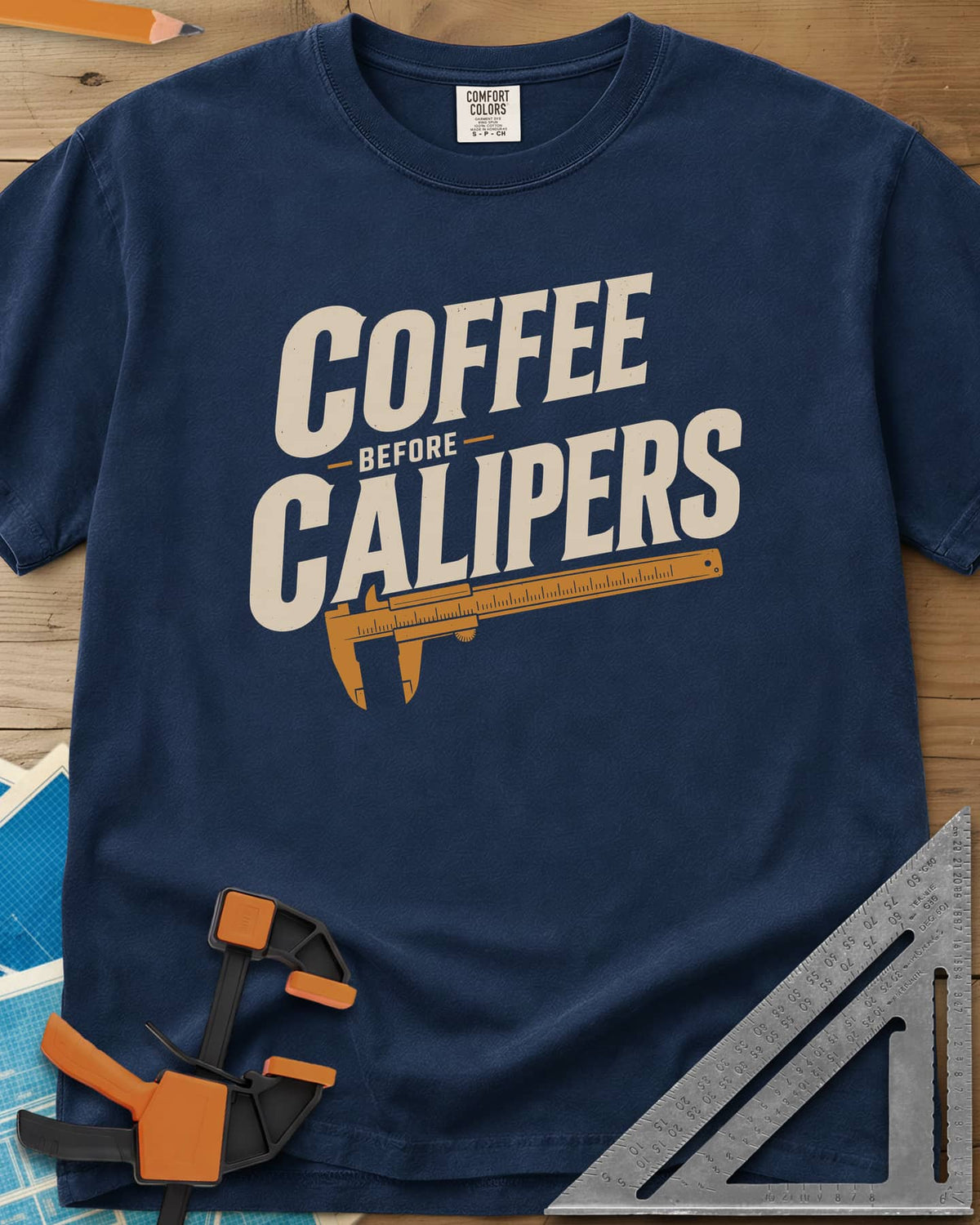 Coffee First heavyweight tee in Navy, bold slanted lettering with an orange vernier caliper below