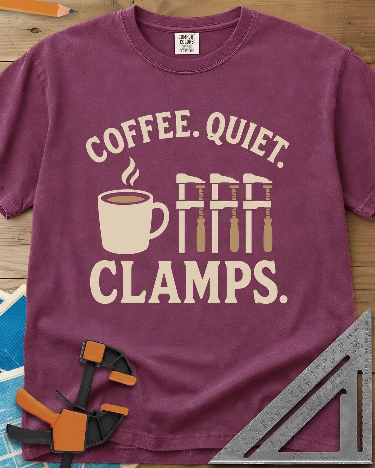Coffee Quiet Clamps heavyweight tee in Berry, a steaming mug beside three matching bar clamps