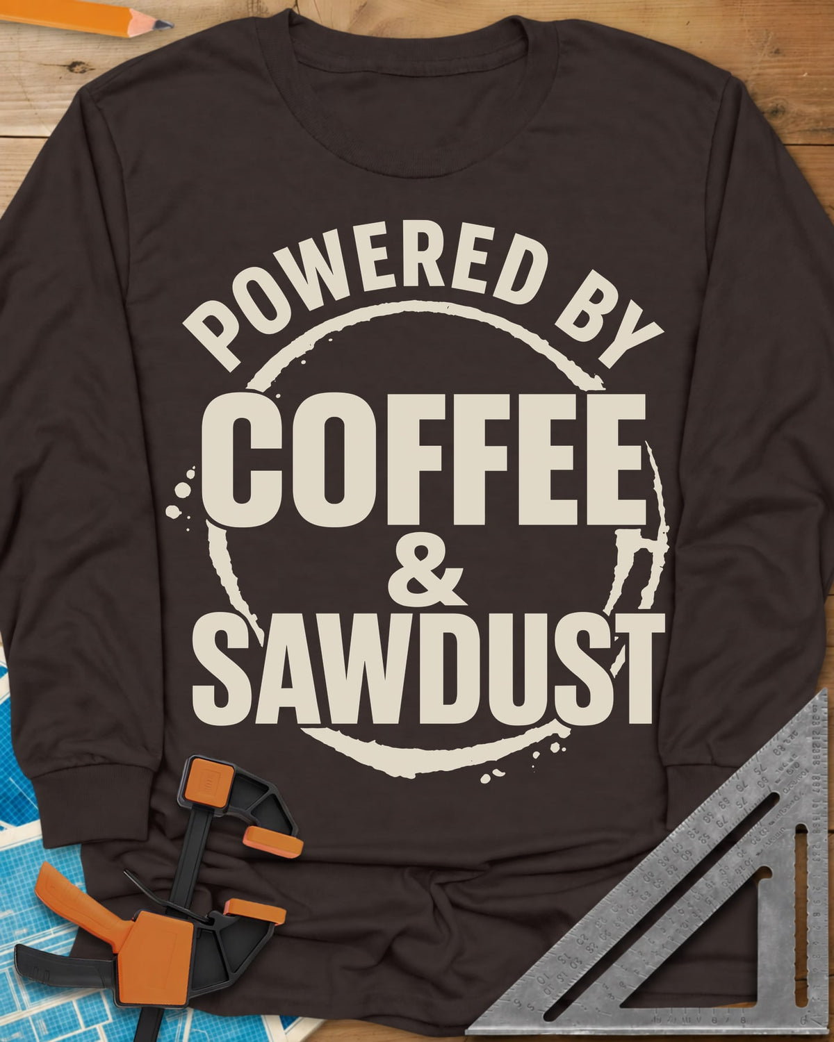 Coffee & Sawdust long sleeve shirt in Dark Chocolate, stacked lettering inside a brown coffee-ring stain