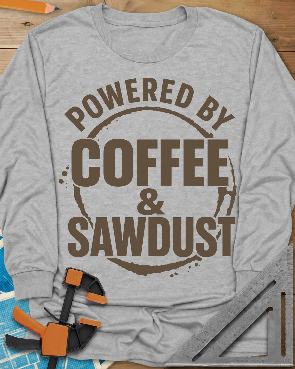 Coffee & Sawdust long sleeve shirt in Sport Grey, stacked lettering inside a brown coffee-ring stain