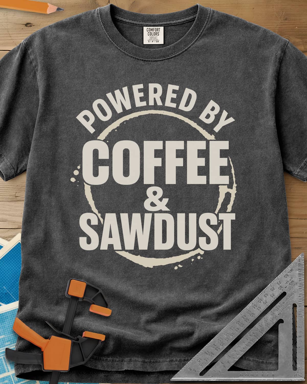 Coffee & Sawdust heavyweight tee in Pepper, stacked lettering inside a brown coffee-ring stain