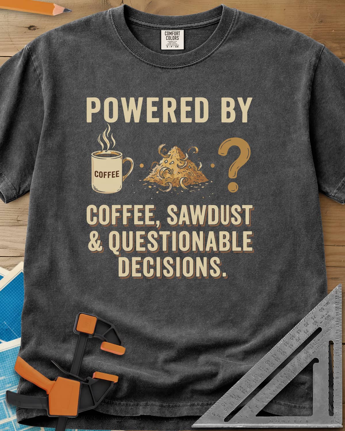 Coffee Sawdust & Questionable Decisions heavyweight tee in Pepper, a coffee mug, a sawdust pile and a question mark