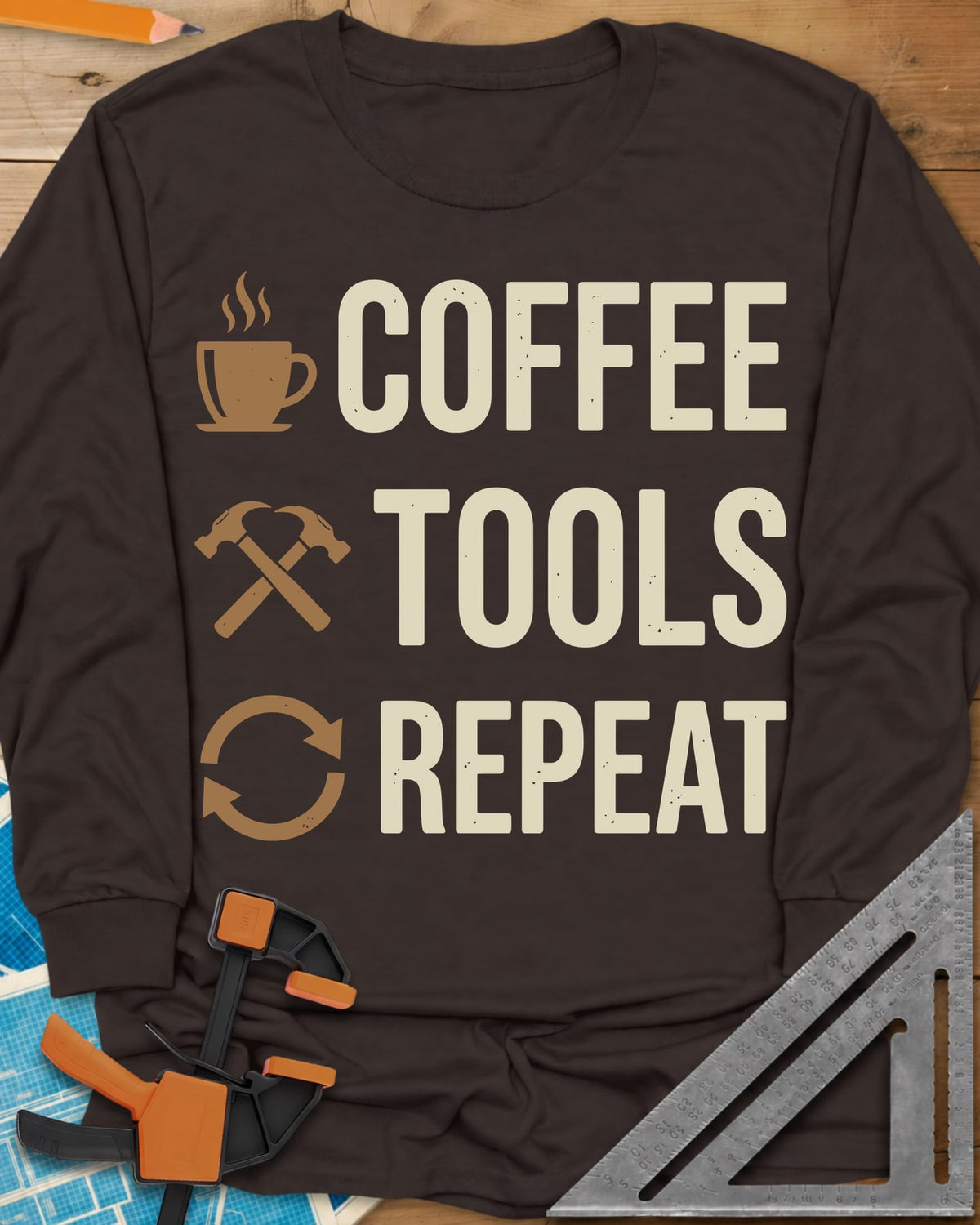 Coffee Tools Repeat long sleeve shirt in Dark Chocolate, a steaming cup, crossed hammers and loop arrows beside the words