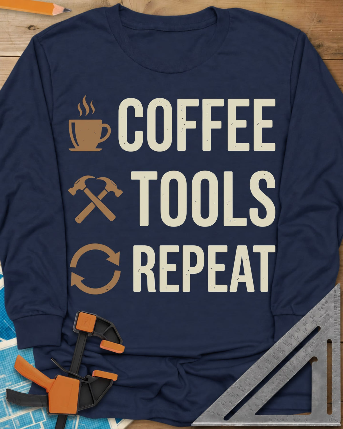 Coffee Tools Repeat long sleeve shirt in Navy, a steaming cup, crossed hammers and loop arrows beside the words