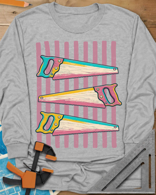Colorful Saws long sleeve shirt in Sport Grey, three hand saws in teal, yellow and pink over pink stripes