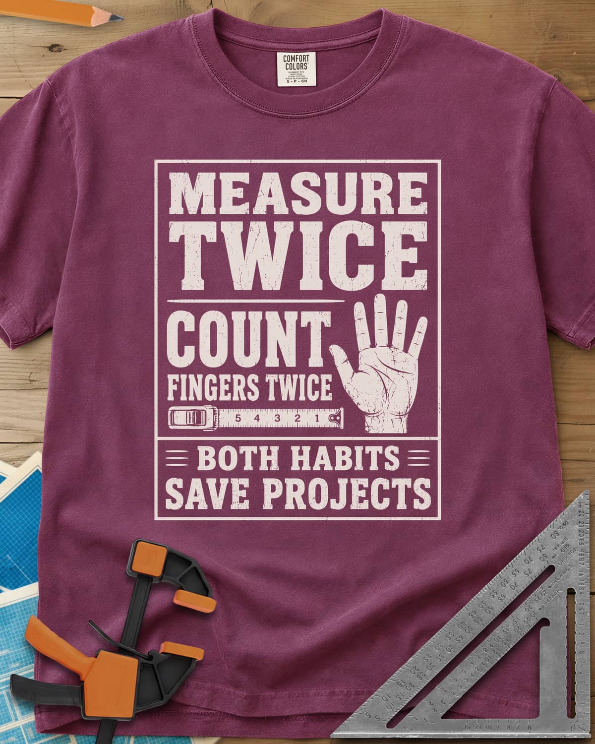 Count Fingers Twice heavyweight tee in Berry, a framed poster print with a raised open hand and a tape measure