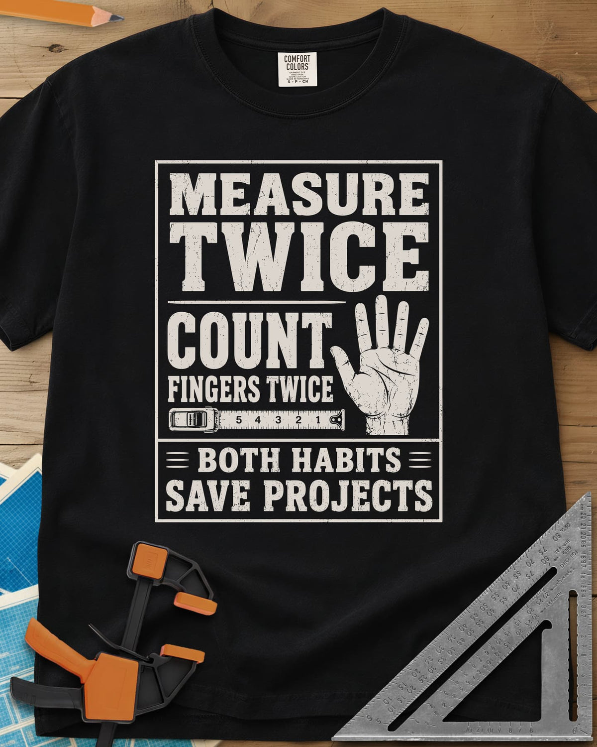 Count Fingers Twice heavyweight tee in Black, a framed poster print with a raised open hand and a tape measure