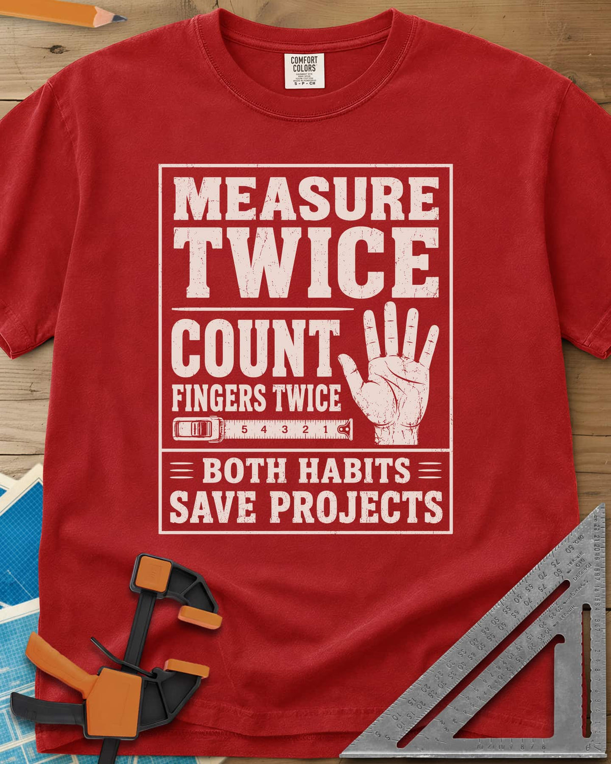 Count Fingers Twice heavyweight tee in Red, a framed poster print with a raised open hand and a tape measure