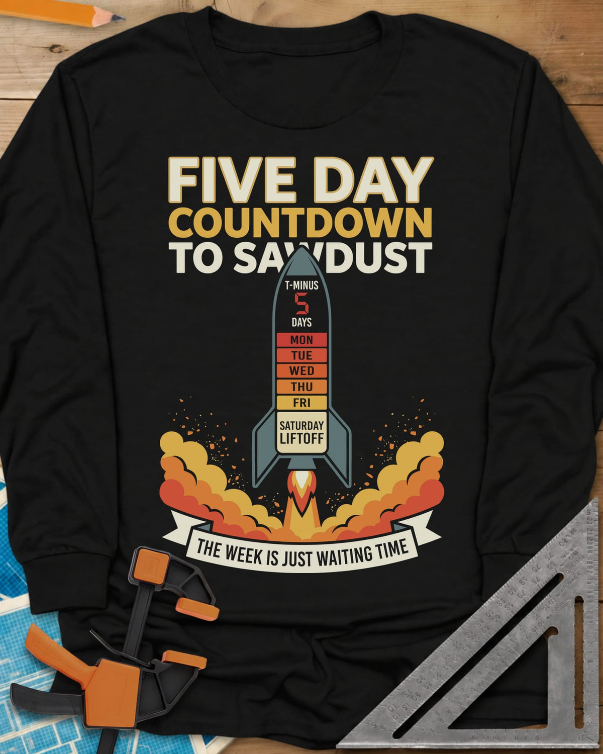 Countdown to Sawdust long sleeve shirt in Black, a rocket with a Monday-to-Saturday countdown on its hull