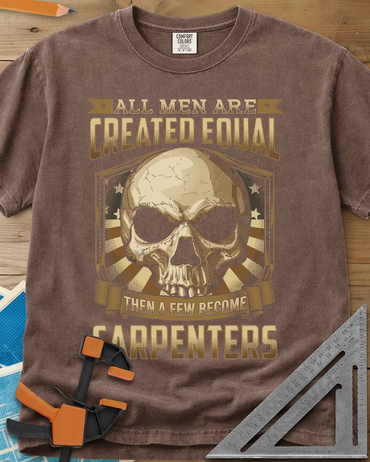 Created Equal Carpenter heavyweight tee in Espresso, a cracked skull on a shield with stars and sunburst rays