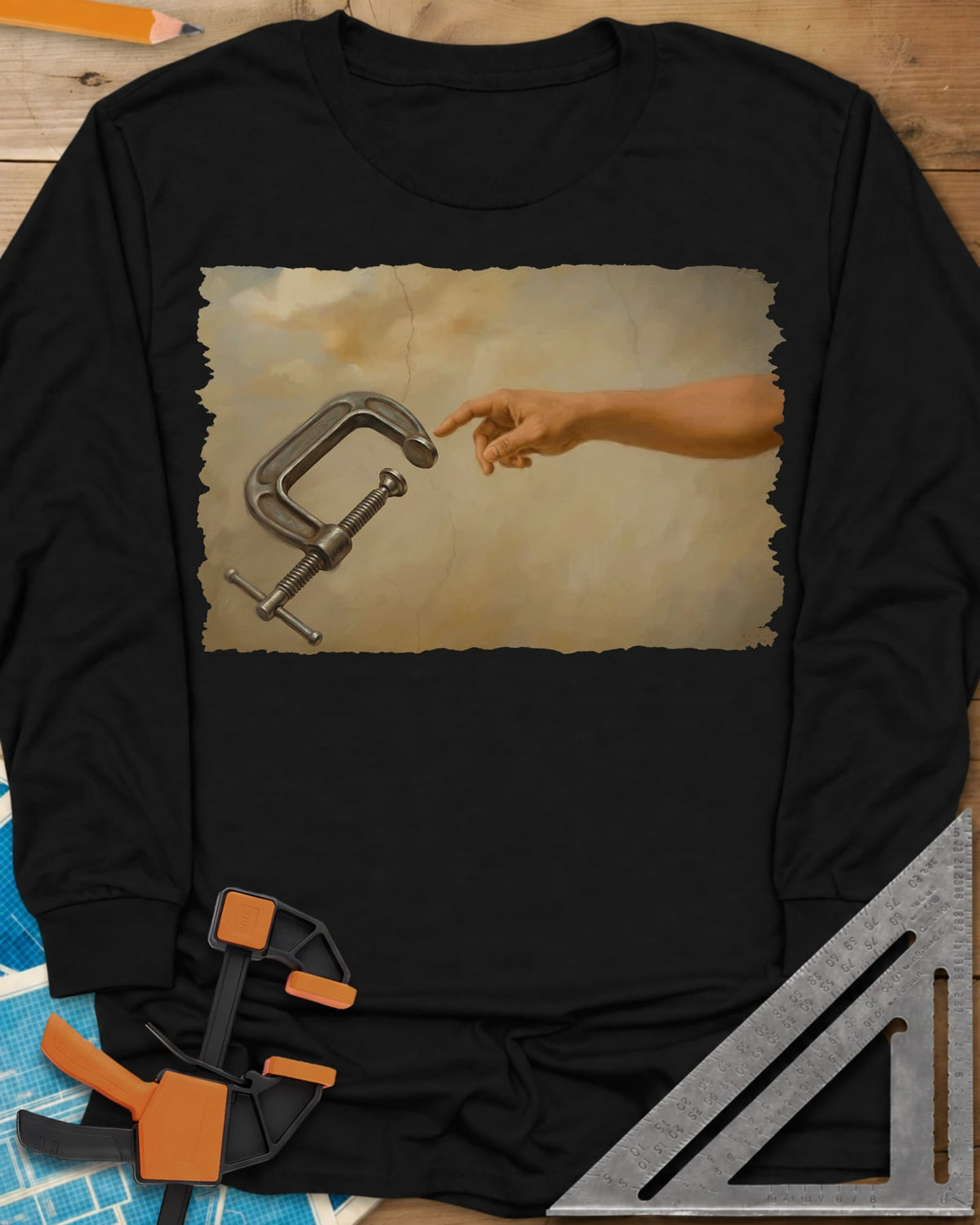 Creation Of The Clamp Woodworking long sleeve shirt in Black, a hand reaching for a C-clamp in an aged fresco style