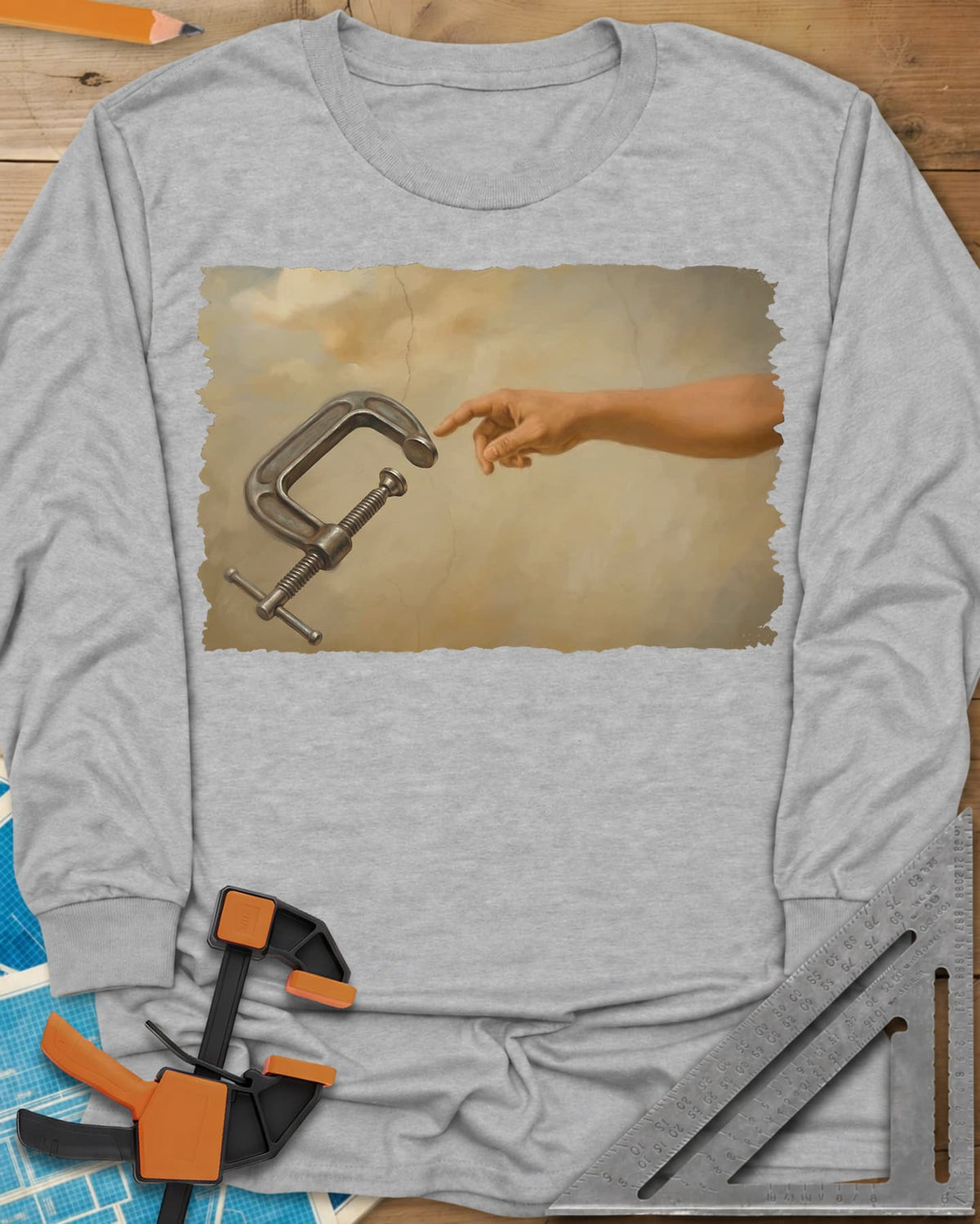 Creation Of The Clamp Woodworking long sleeve shirt in Sport Grey, a hand reaching for a C-clamp in an aged fresco style