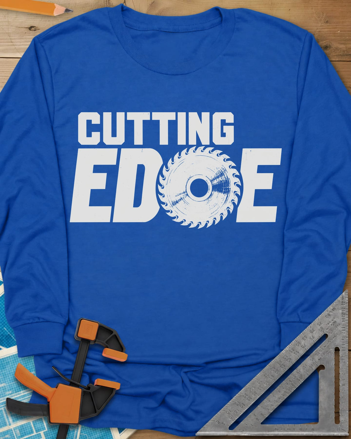 Cutting Edge long sleeve shirt in Royal, bold lettering with a circular saw blade standing in for the G