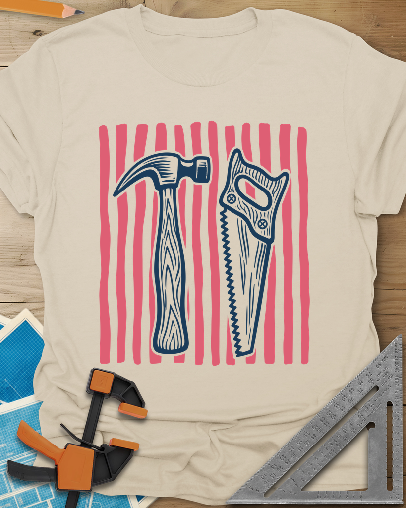 Hammer & Saw t-shirt in Sand, a claw hammer and a handsaw over hand-drawn coral stripes