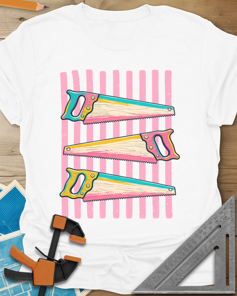 Colorful Saws t-shirt in White, three hand saws in teal, yellow and pink over pink stripes