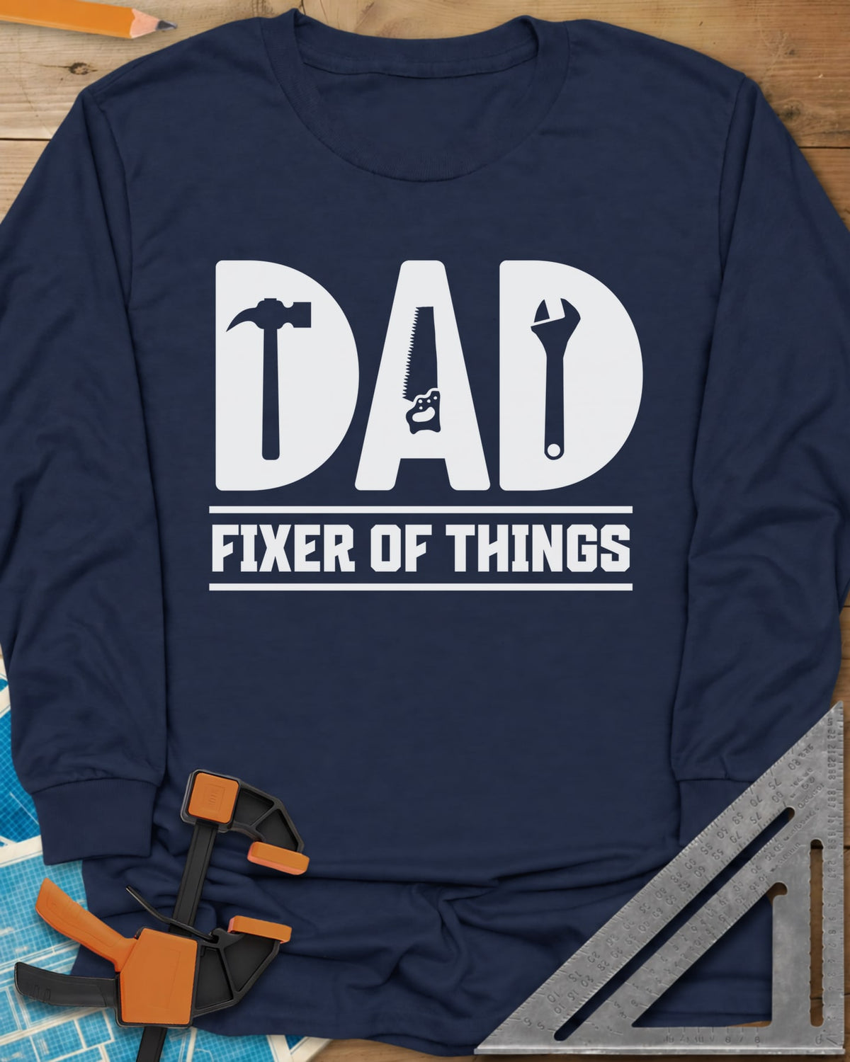 Dad, Fixer of All Things long sleeve shirt in Navy, big letters spelling DAD with a hammer, saw and wrench cut in