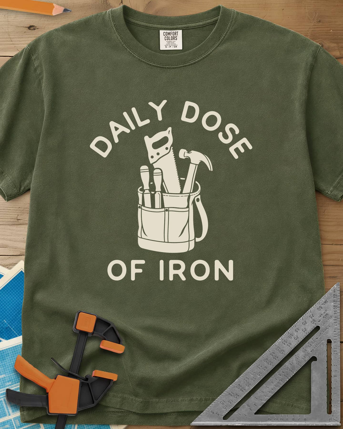 Daily Dose heavyweight tee in Hemp, a canvas tool bag holding a handsaw, hammer and two chisels