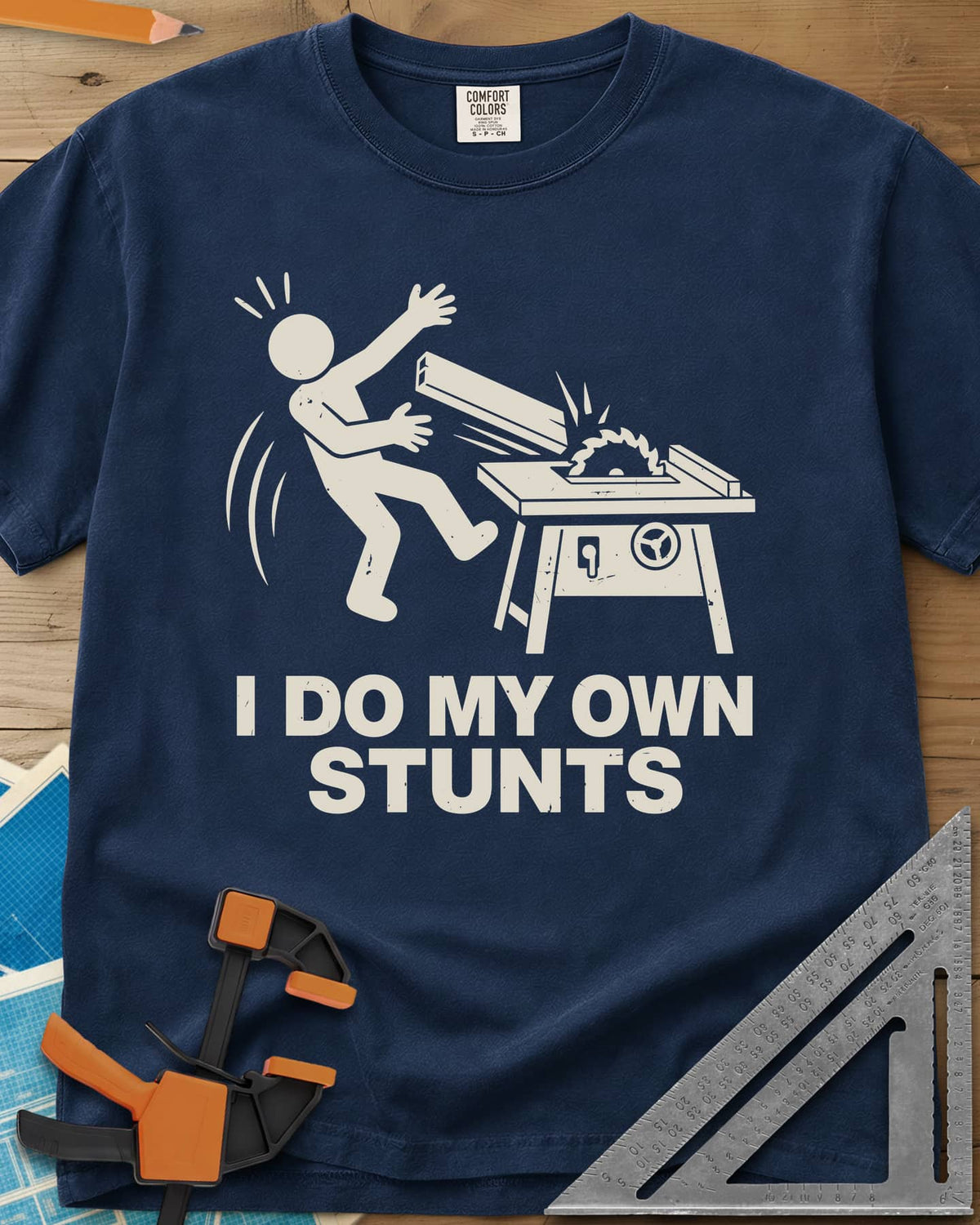 DIY Stunts heavyweight tee in Navy, a stick figure leaning back as a board flies off a table saw