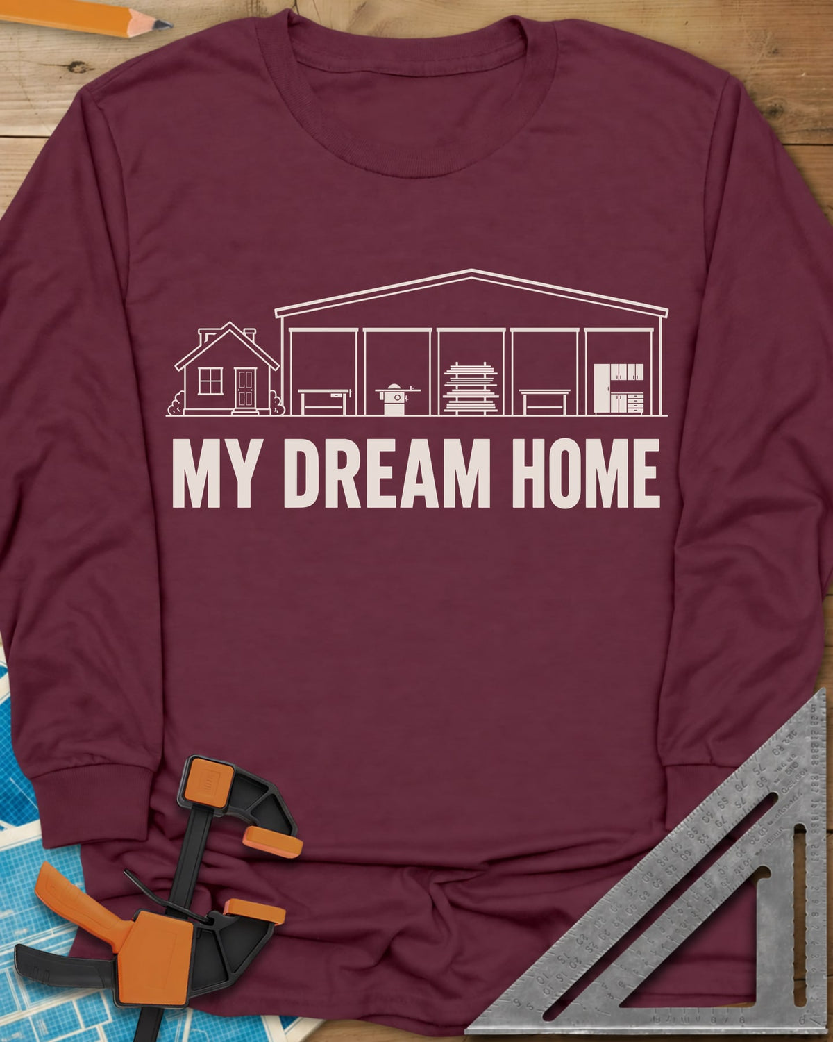 Dream Home long sleeve shirt in Maroon, a small house beside a huge five-bay woodworking shop