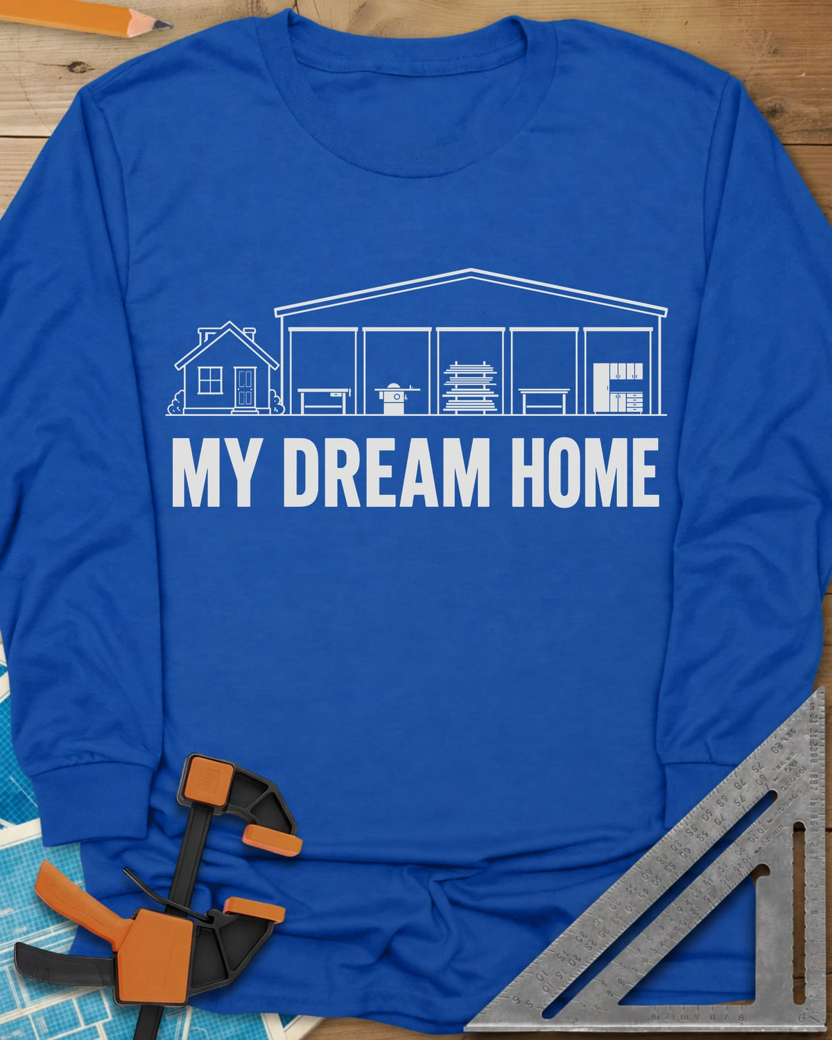 Dream Home long sleeve shirt in Royal, a small house beside a huge five-bay woodworking shop