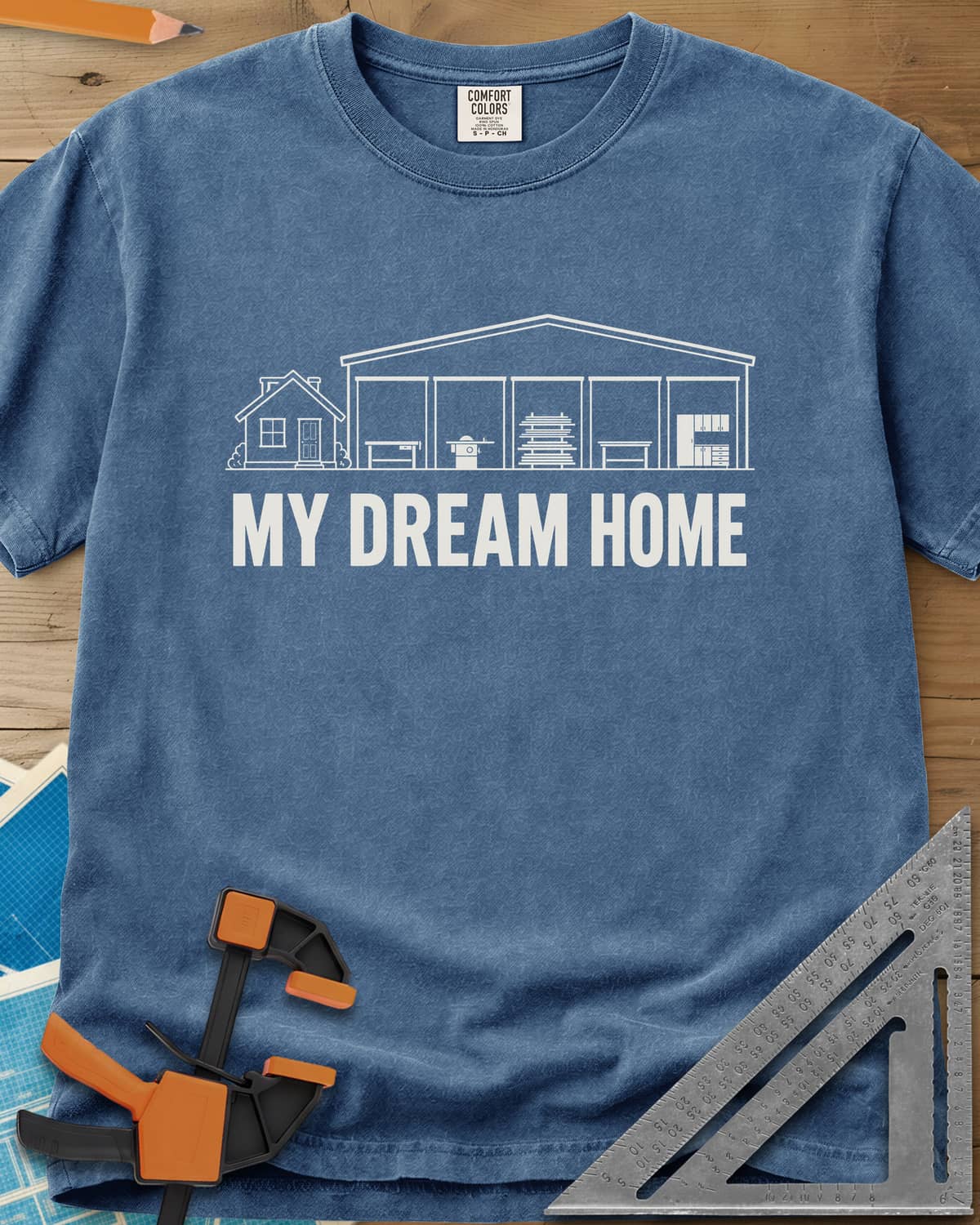 Dream Home heavyweight tee in Blue Jean, a small house beside a huge five-bay woodworking shop