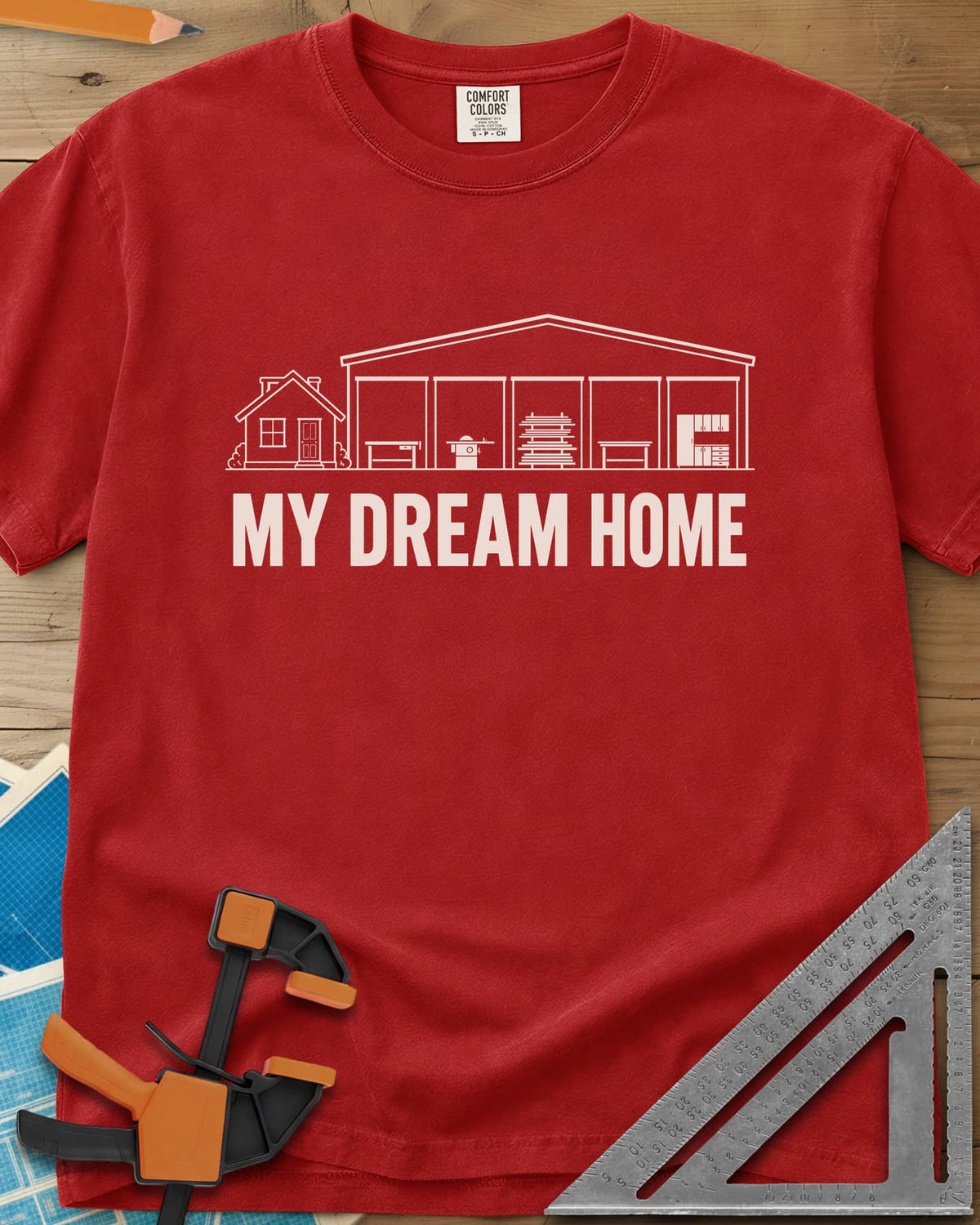 Dream Home heavyweight tee in Red, a small house beside a huge five-bay woodworking shop