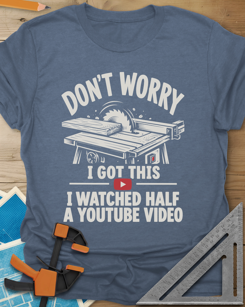 YouTube Video t-shirt in Heather Indigo, a table saw with a board at the blade above a red play button