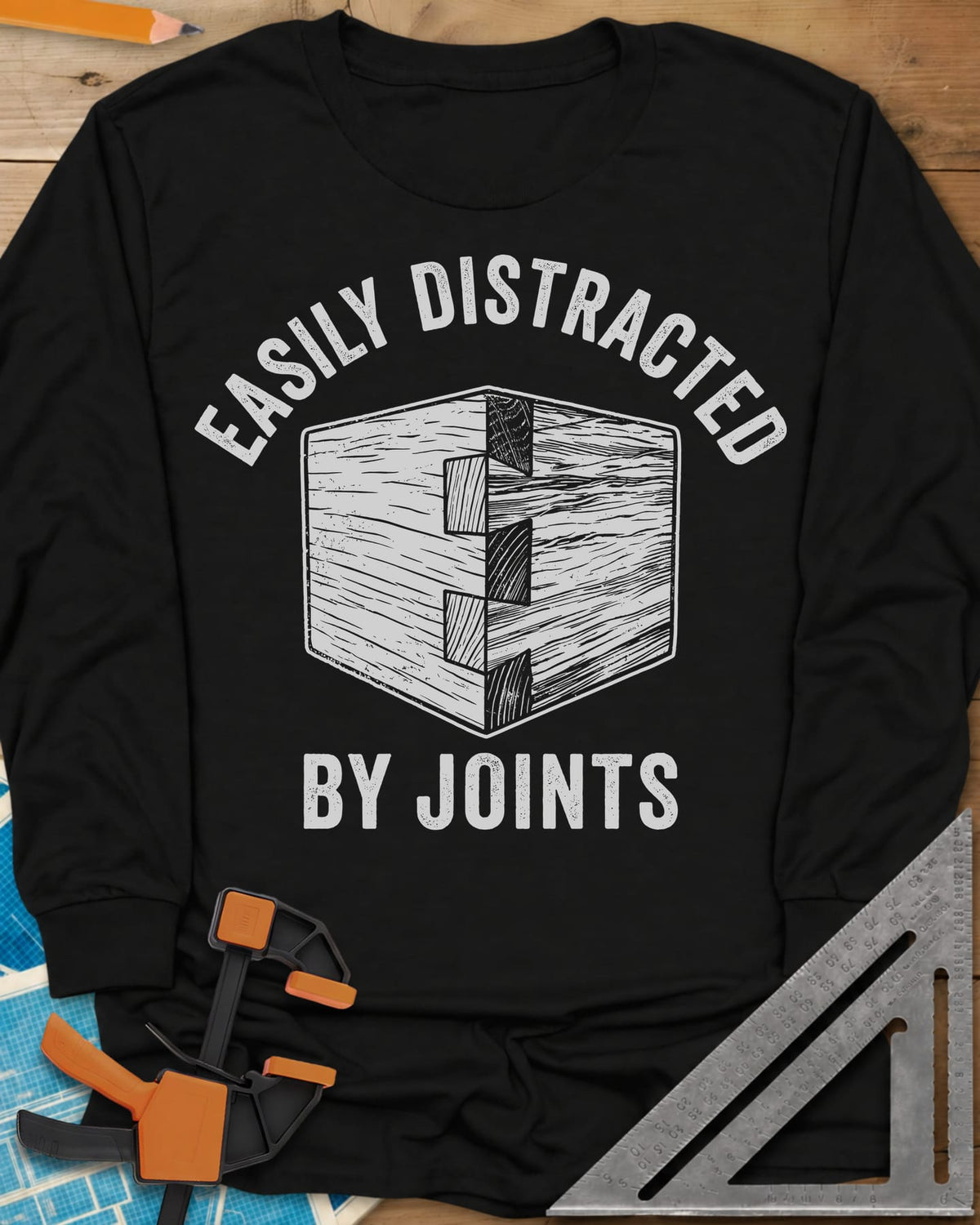 Easily Distracted by Joints long sleeve shirt in Black, a woodcut-style dovetail joint at a box corner