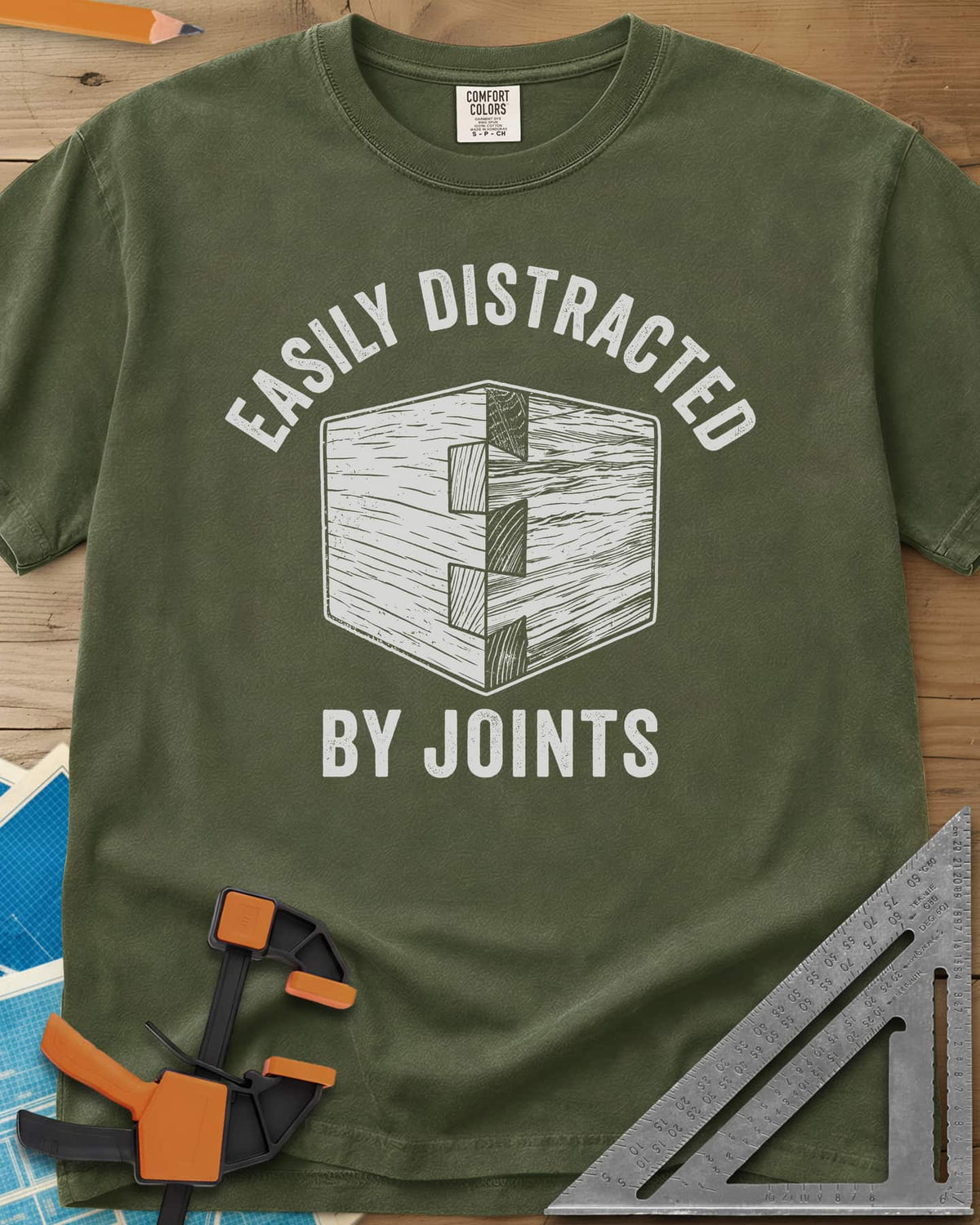 Easily Distracted by Joints heavyweight tee in Hemp, a woodcut-style dovetail joint at a box corner