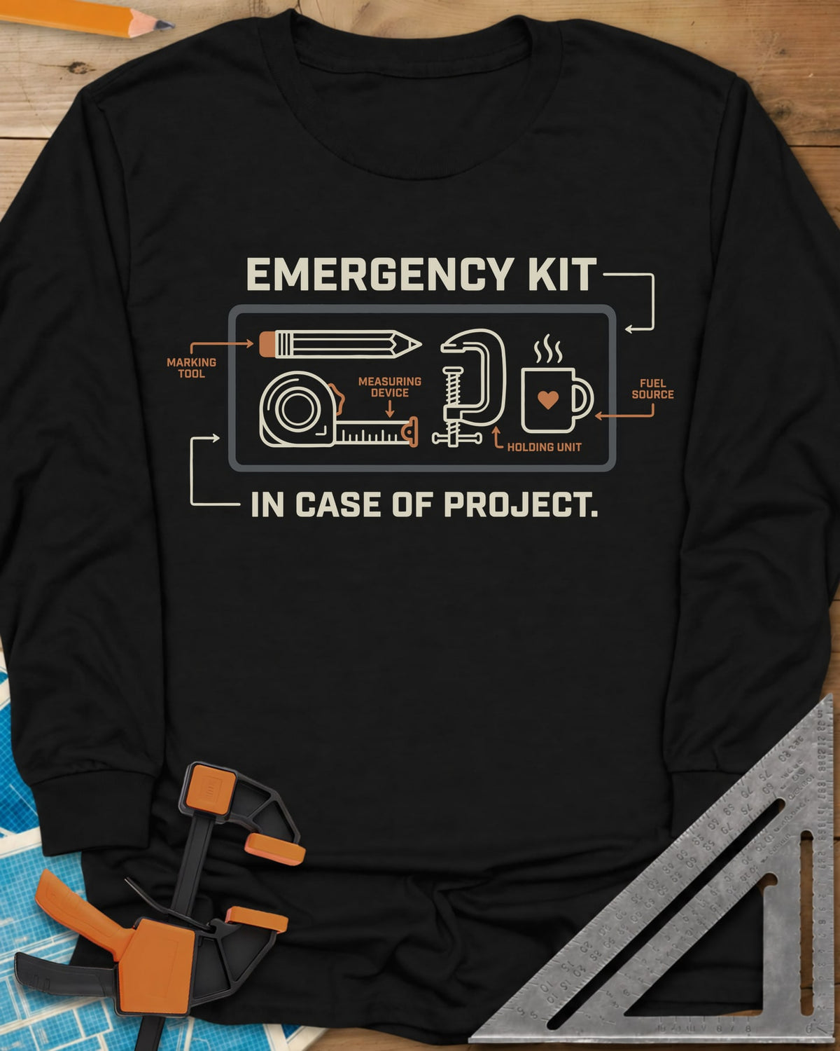 Emergency Kit Project long sleeve shirt in Black, a labeled kit diagram: pencil, tape, clamp and heart mug