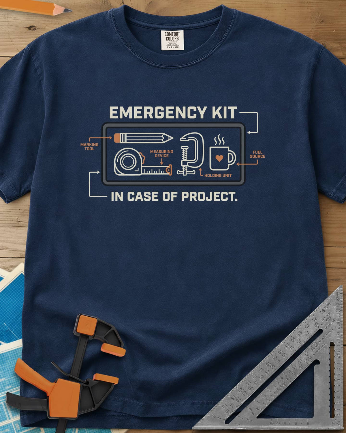 Emergency Kit Project heavyweight tee in Navy, a labeled kit diagram: pencil, tape, clamp and heart mug
