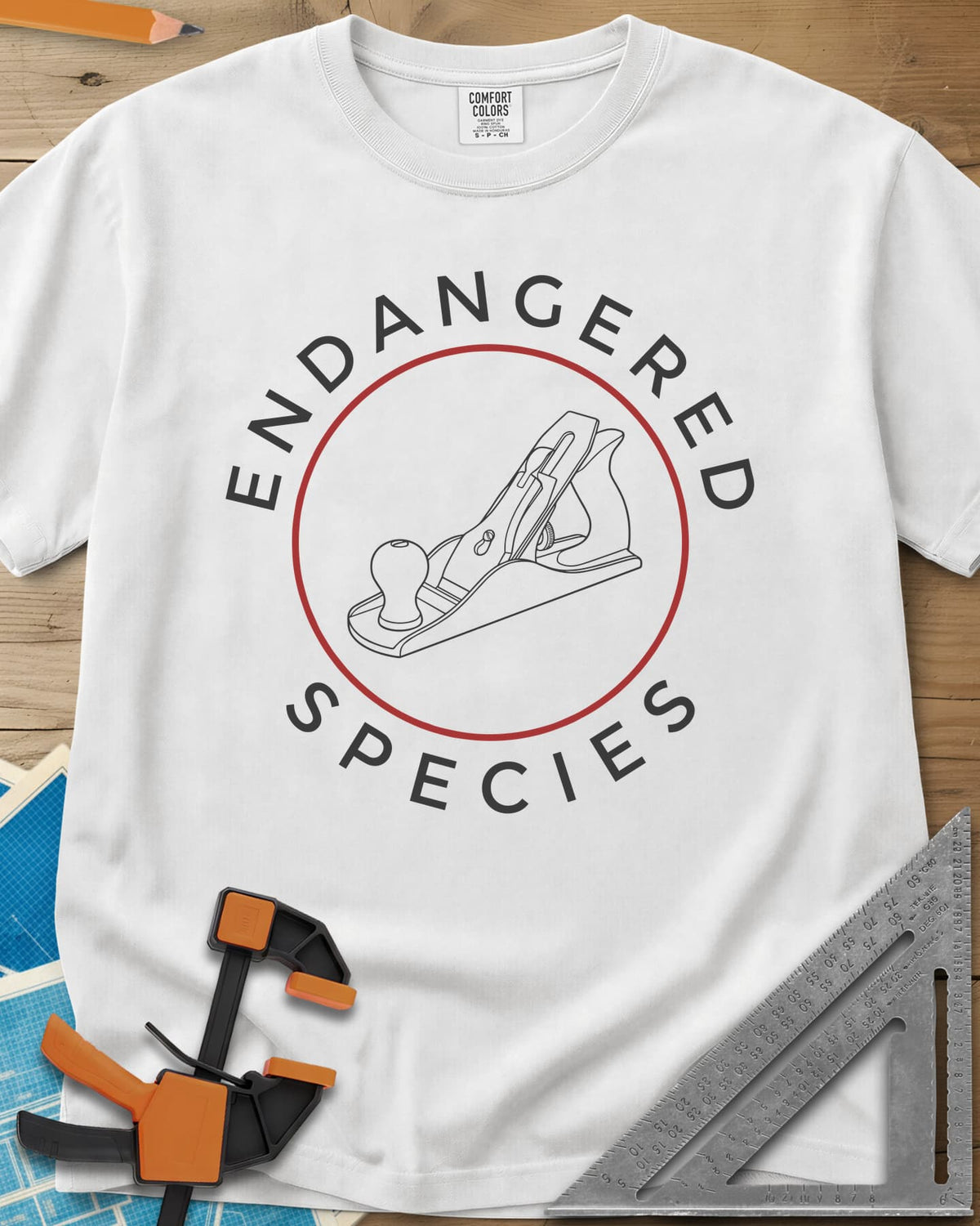 Endangered Species heavyweight tee in White, a hand plane line drawing inside a rust-red circle