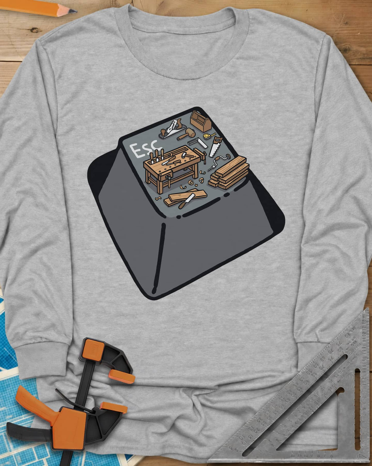 Escape To Shop long sleeve shirt in Sport Grey, a keyboard Esc key with a tiny woodshop scene on top