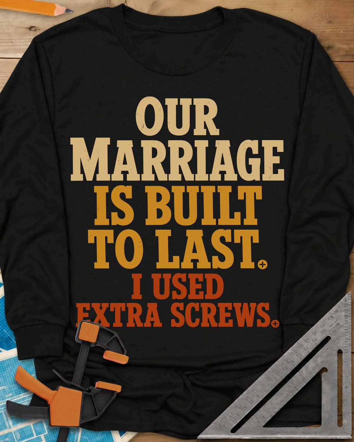 Extra Screws long sleeve shirt in Black, stacked lettering in cream, mustard and rust with tiny screw heads