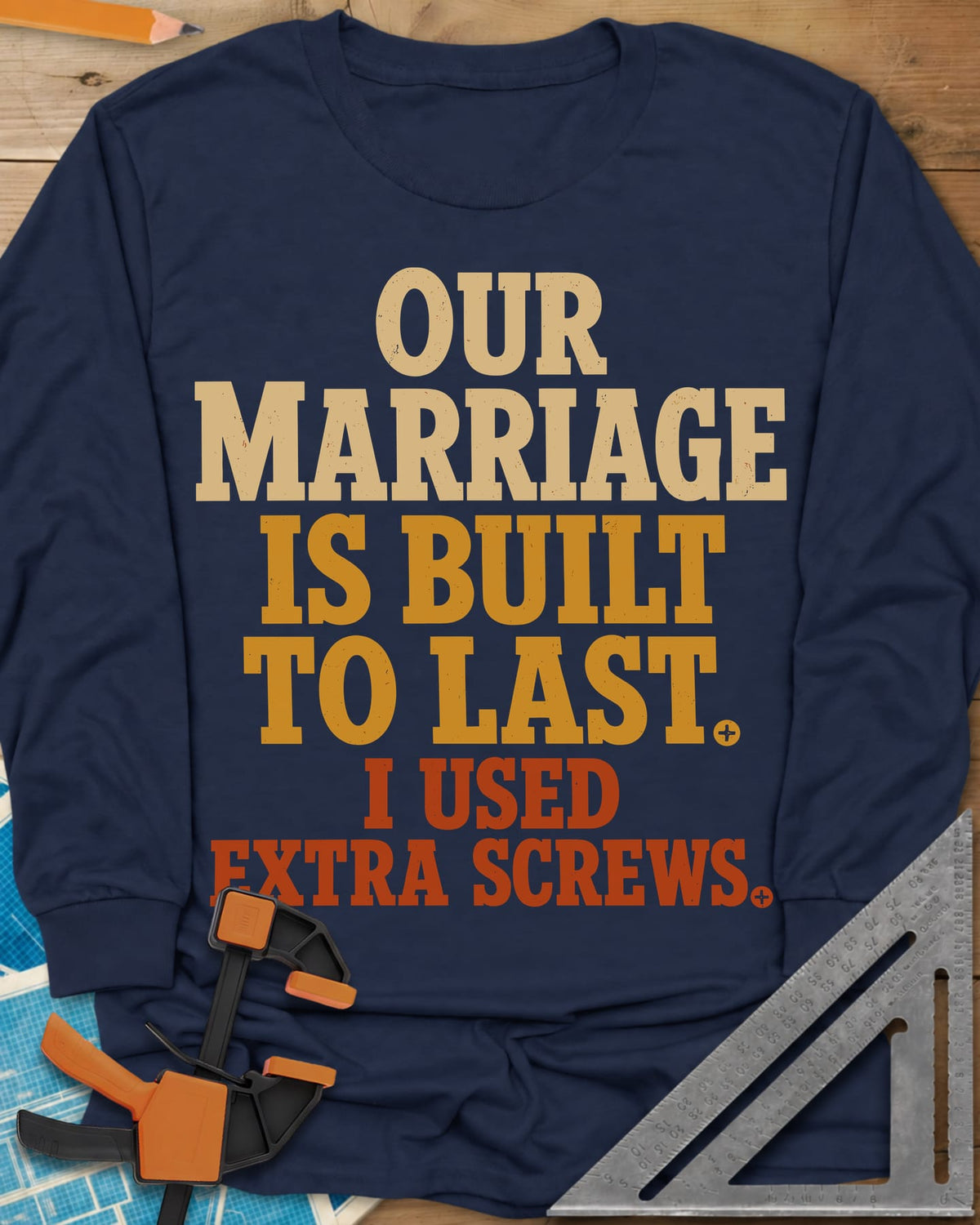 Extra Screws long sleeve shirt in Navy, stacked lettering in cream, mustard and rust with tiny screw heads