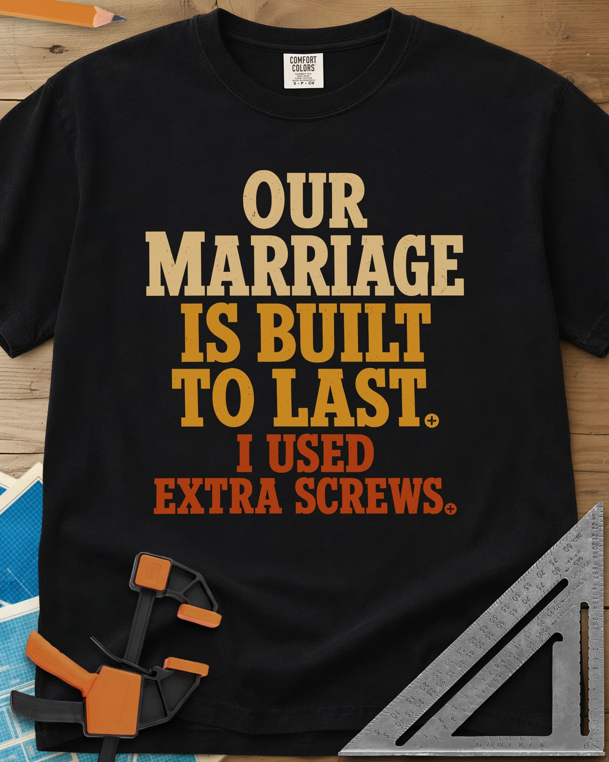 Extra Screws heavyweight tee in Black, stacked lettering in cream, mustard and rust with tiny screw heads