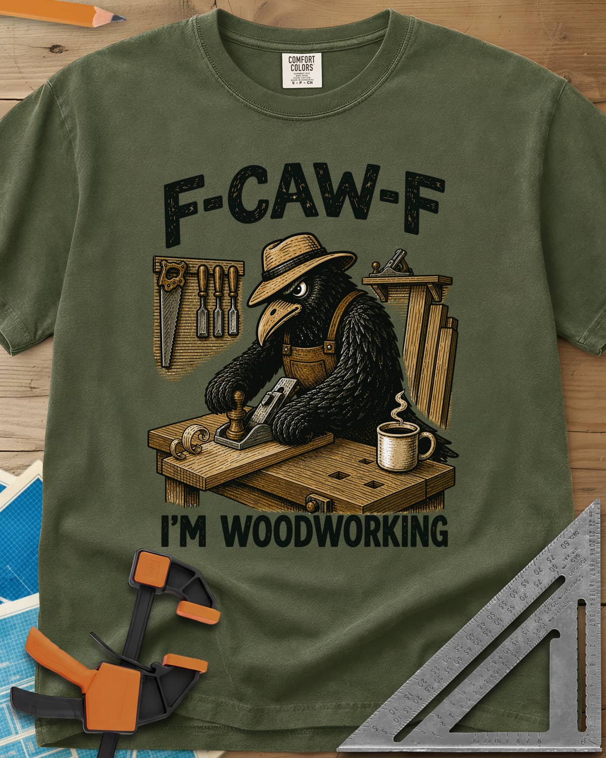 F Caw F Im Woodworking Crow heavyweight tee in Hemp, a crow in a straw hat planing a board at a workbench