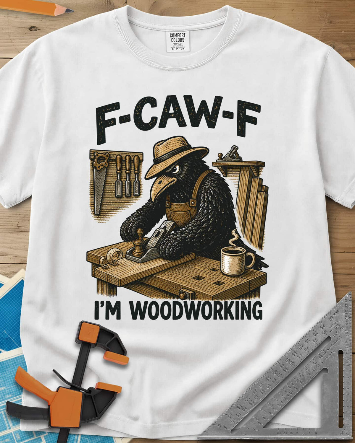 F Caw F Im Woodworking Crow heavyweight tee in White, a crow in a straw hat planing a board at a workbench