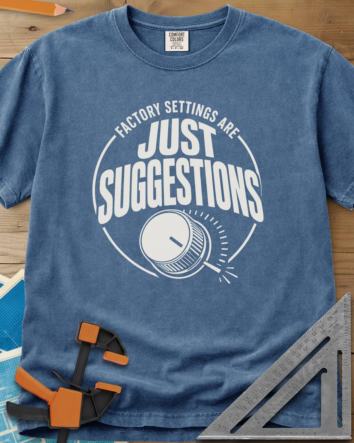 Factory Suggestions heavyweight tee in Blue Jean, a round badge with a dial knob and tick marks